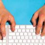 Hands typing on a keyboard. 
