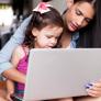 woman with child and laptop computer