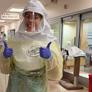 nurse shows full protective gear in covid section of hospital