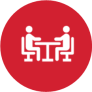 Red circle with white icon of two people sitting at a table across from each other