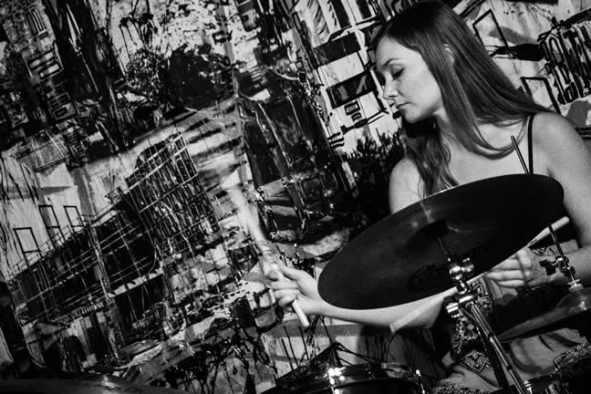 Tina Raymond playing the drums