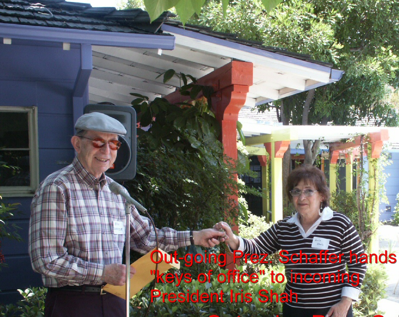 President Schaffer hands over "keys of office" to incoming President Iris Shah