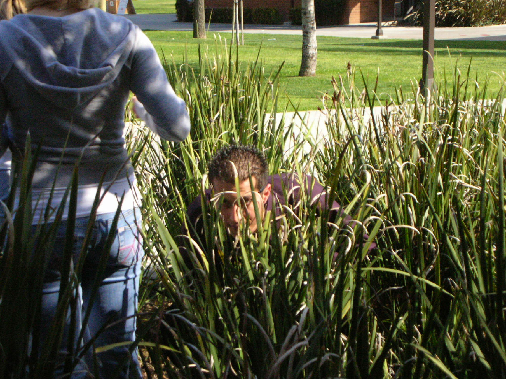 A picture of Gabe hiding in the bushes while looking for eggs.