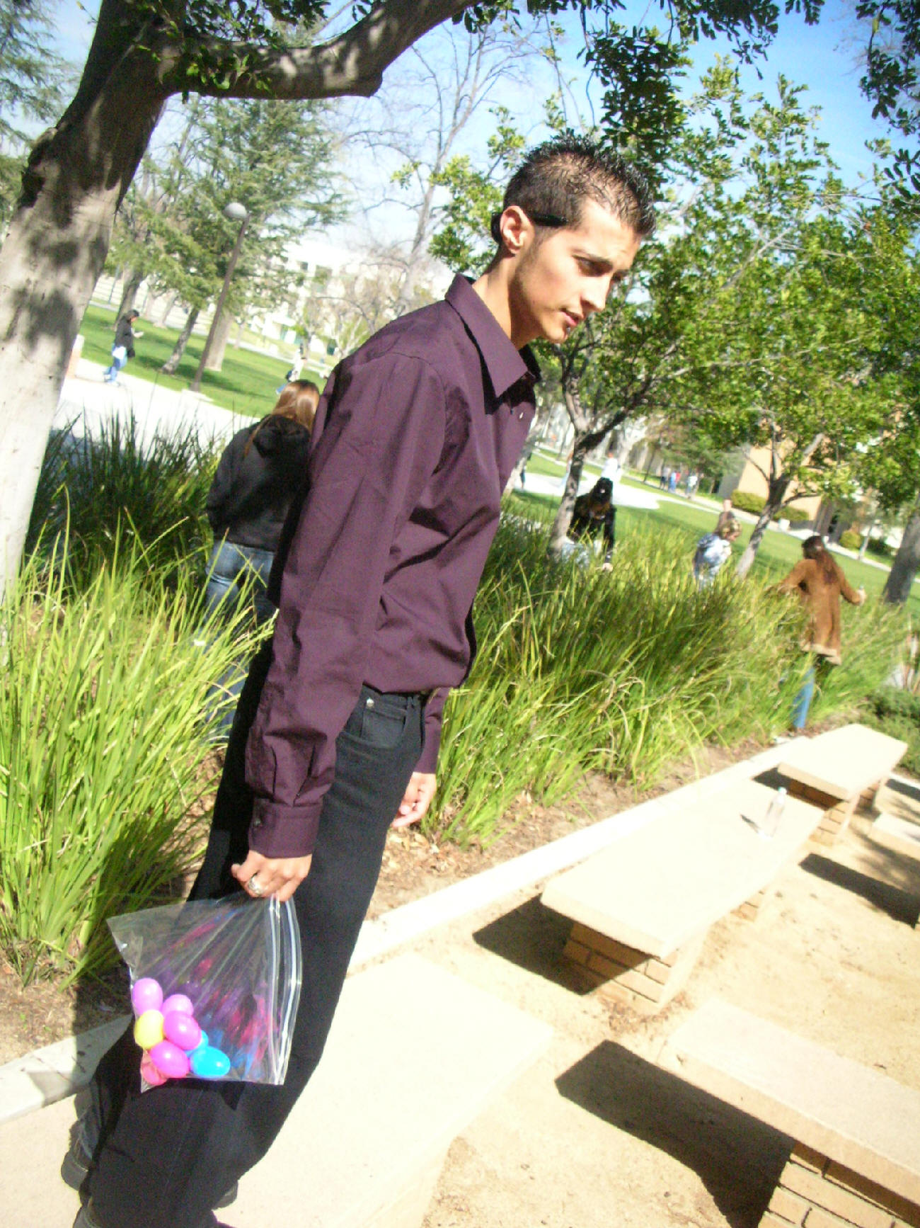 Gabe holding a bag with Easter eggs.