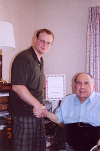 Dr Romagnoli and Chaba (Student) shaking hands